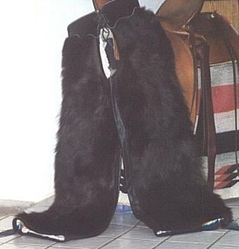 #207 bear hair woolies lined in pilow ticking with black leather fringe (call for price)
